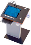 ILS 17S Lectern. 17 inch touch screen, built in mini PC, height adj. electric pedestal, steel with wood top, floodlights for paper reading, flush glass of display with surface. Kiosk & non-LCD Lectern versions available. Designed and made in Germany.